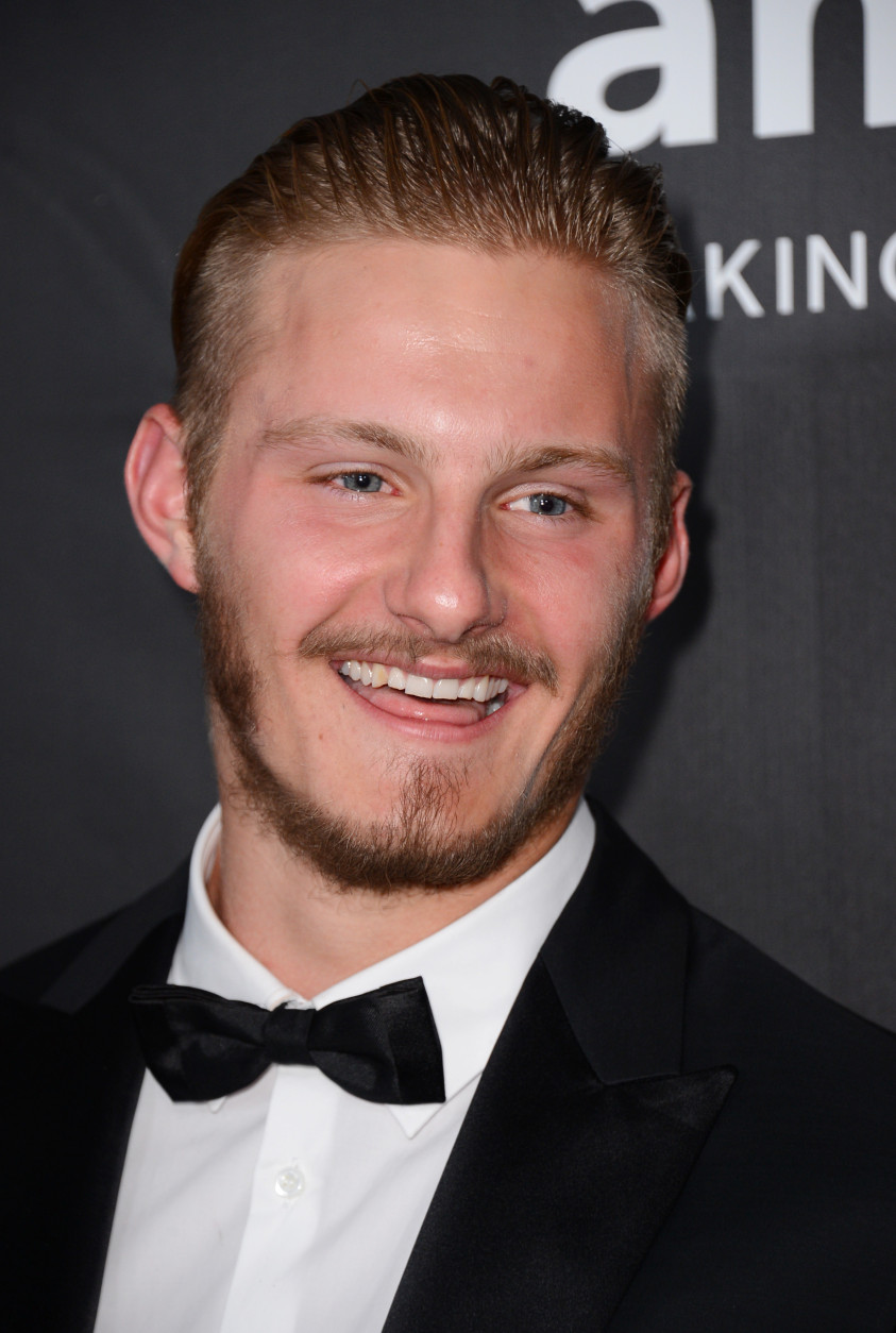 Alexander Ludwig arrives at the 2014 amfAR Inspiration Gala at Milk Studios on Wednesday, Oct. 29, in Los Angeles. (Photo by Jordan Strauss/Invision/AP)