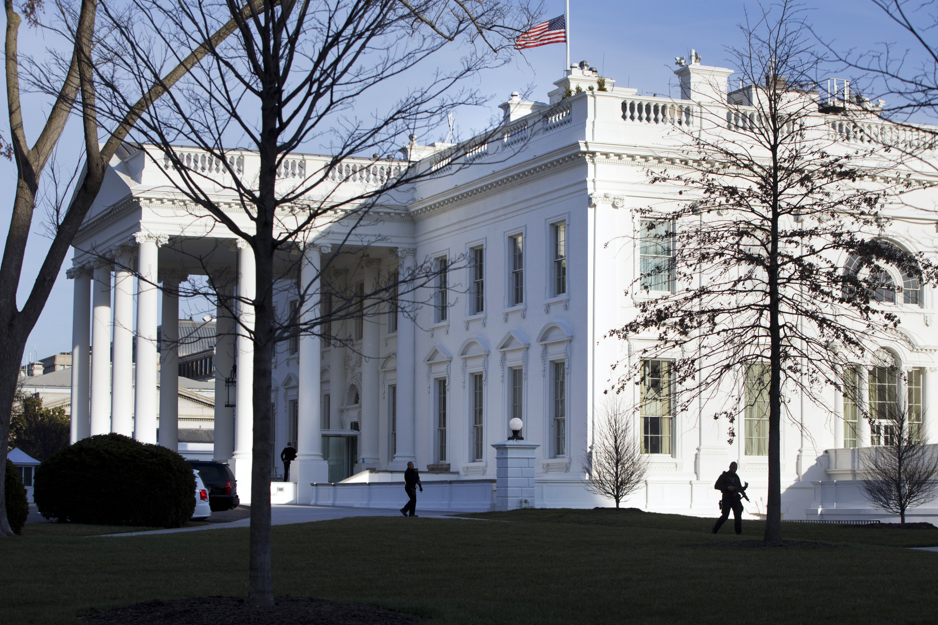 Uniformed Secret Service police officers are silhouetted by the White House as they patrol the North Lawn of the White House after a lock down was lifted at the White House in Washington, Monday, March 7, 2016. (AP Photo/Jacquelyn Martin)