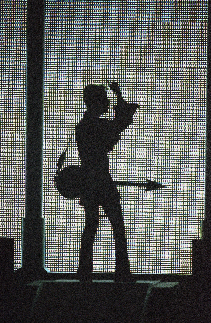 The artist formally known as Prince, silhouetted with his guitar in front of a large television screen, performs ?Holly River? at the ?4th annual VH1 Honors? on Thursday, April 10, 1997 in Universal City, Calif. (AP Photo/Mark J. Terrill)