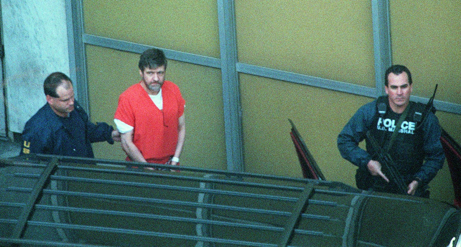 Convicted Unabomber Theodore Kaczynski, center, is led from the Federal Courthouse in Sacramento, Calif., Thursday Jan. 22, 1998 following his guilty plea to all charges in the case. In return, Kaczynski will spend the rest of his life in prison without parole. (AP Photo/Bob Galbraith)