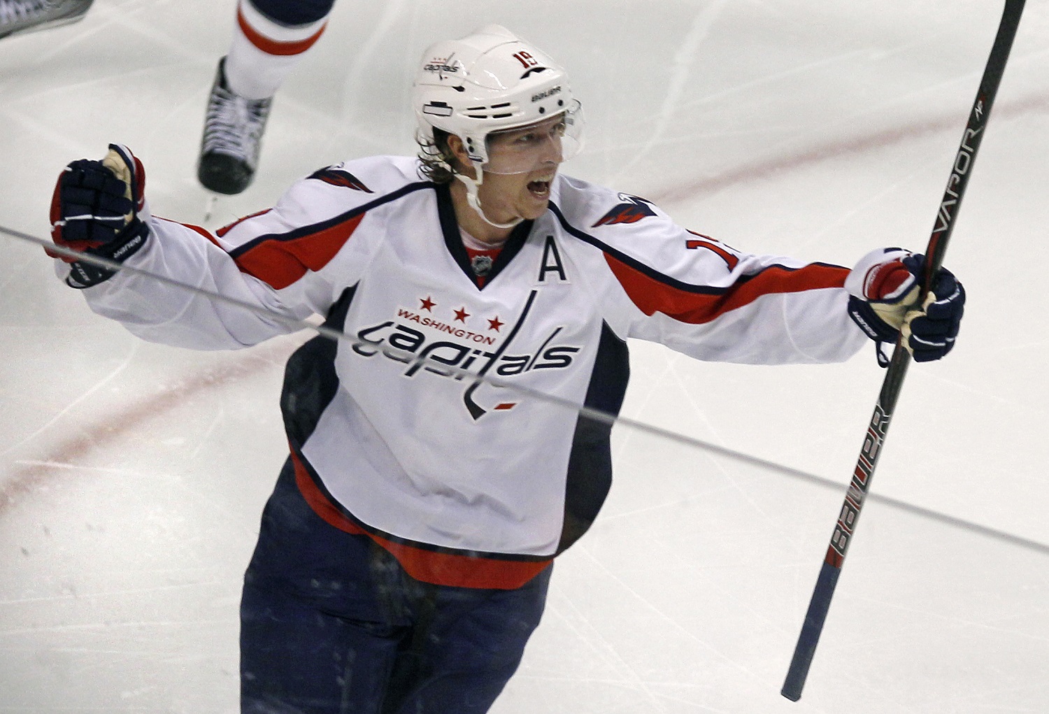 Washington Capitals center Nicklas Backstrom (19) celebrates his game-winning goal against the Boston Bruins during the second overtime period of Game 2 of an NHL hockey Stanley Cup first-round playoff series in Boston, Saturday, April 14, 2012.  The Capitals won 2-1, tying the series at 1-1. (AP Photo/Charles Krupa)