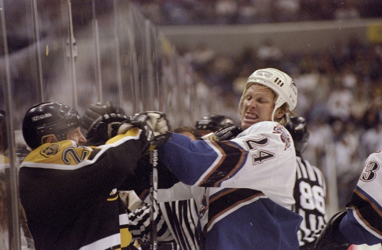 24 Apr 1998:  Center Tim Taylor of the Boston Bruins in action against defenseman Mark Tinardi of the Washington Capitals during an NHL playoff game at the MCI Center in Washington, D. C.  The Bruins defeated the Capitals 4-3. Mandatory Credit: Ezra O. Sh