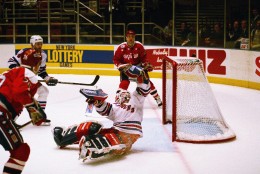 New York Rangers goalie Mike Richter reaches to make a glove save on a shot on goal by the Washington Capitals during third period action on Tuesday, May 3, 1994 at Madison Square Garden in New York The Rangers beat the Capitals 5-2 taking a 2-0 lead in their conference playoff series.    Caps Steve Konowalchuk, rear, watches the grab. (AP Photo/Ron Frehm)