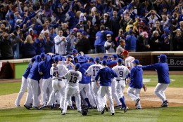 Chicago Cubs players celebrate after winning Game 4 in baseball's National League Division Series, Tuesday, Oct. 13, 2015, in Chicago. The Cubs won 4-6. (AP Photo/Nam Y. Huh)