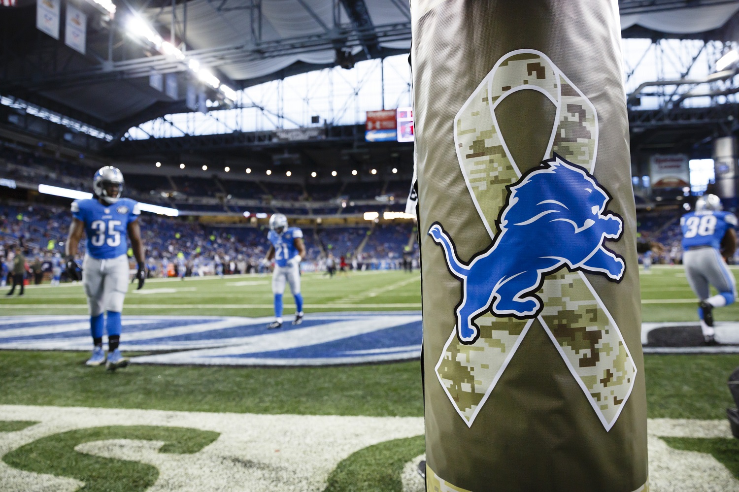 Salute to Service logo is seen on the goal post pad during warms up prior to an NFL football game between the Detroit Lions and the Oakland Raiders at Ford Field in Detroit, Sunday, Nov. 22, 2015. (AP Photo/Rick Osentoski)
