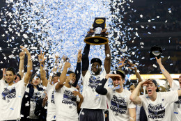 HOUSTON, TEXAS - APRIL 04:  Daniel Ochefu #23 of the Villanova Wildcats (C) hoists the trophy after the Villanova Wildcats defeat the North Carolina Tar Heels 77-74 to win the 2016 NCAA Men's Final Four National Championship game at NRG Stadium on April 4, 2016 in Houston, Texas.  (Photo by Streeter Lecka/Getty Images)