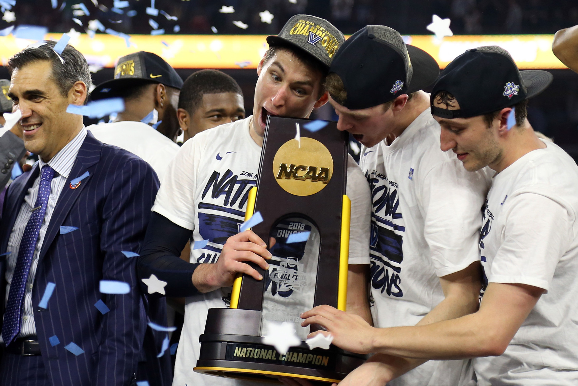 Ryan Arcidiacono #15 of the Villanova Wildcats (L) celebrates with the trophy after defeating the North Carolina Tar Heels 77-74 to win the 2016 NCAA Men's Final Four National Championship game at NRG Stadium on April 4, 2016 in Houston, Texas.  (Photo by Streeter Lecka/Getty Images)