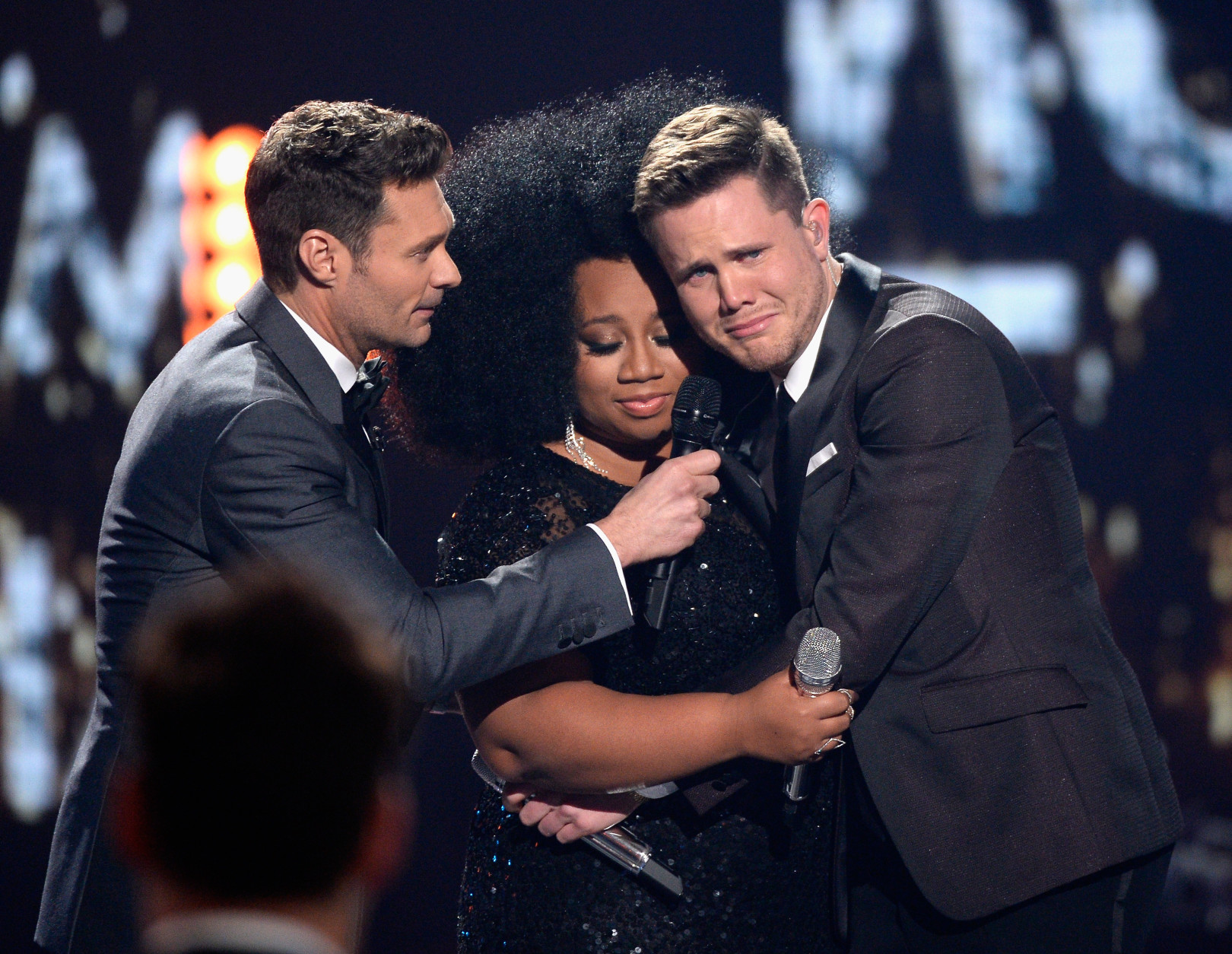 American Idol Season 15 winner Trent Harmon (R), host Ryan Seacrest (L) and finalist La'Porsha Renae speak onstage during FOX's 'American Idol' Finale For The Farewell Season at Dolby Theatre on April 7, 2016 in Hollywood, California. at Dolby Theatre on April 7, 2016 in Hollywood, California. (Photo by Kevork Djansezian/Getty Images)
