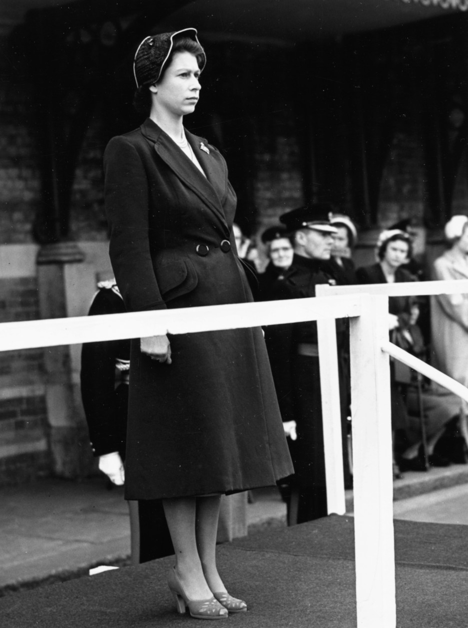 HM Queen Elizabeth II looking stoic as she watches the 3rd Battalion Grenadier Guards march past at Chelsea Barracks, London, May 16th 1951. (Photo by Reg Speller/Fox Photos/Getty Images)