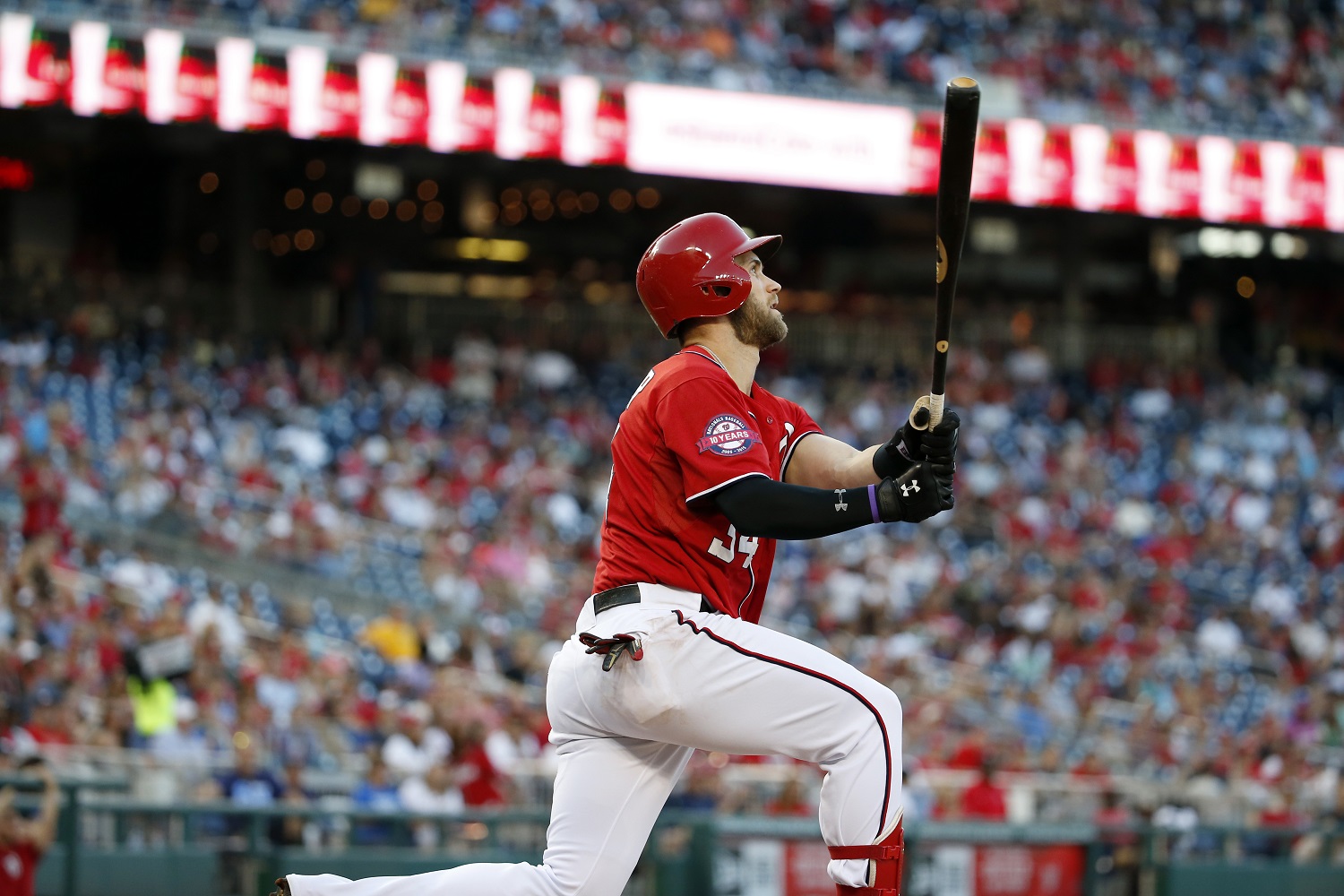 Washington Nationals' Bryce Harper watches his two-run homer during the seventh inning of a baseball game against the Miami Marlins at Nationals Park, Saturday, Sept. 19, 2015, in Washington. The Nationals won 5-2. (AP Photo/Alex Brandon)