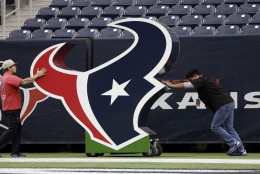 Houston Texans logos are moves at NRG Stadium prior to an NFL football game between the Houston Texans and New York Jets, Sunday, Nov. 22, 2015, in Houston. (AP Photo/David J. Phillip)
