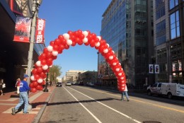 A red balloon arch going up outside the Verizon Center on April 14, 2016 ahead of Game 1. (WTOP/Alan Etter)