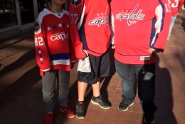 Fans Rick Wiseman (r), Aiden Wiseman (c), and Kayden Ritter (l) seen outside the Verizon Center ahead of Game 1 on April 14, 2016. (WTOP/Alan Etter)
