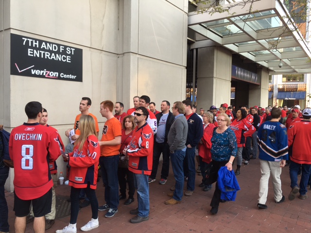 Caps and Flyers fans line up outside the Verizon Center on April 14, 2016. (WTOP/Alan Etter)