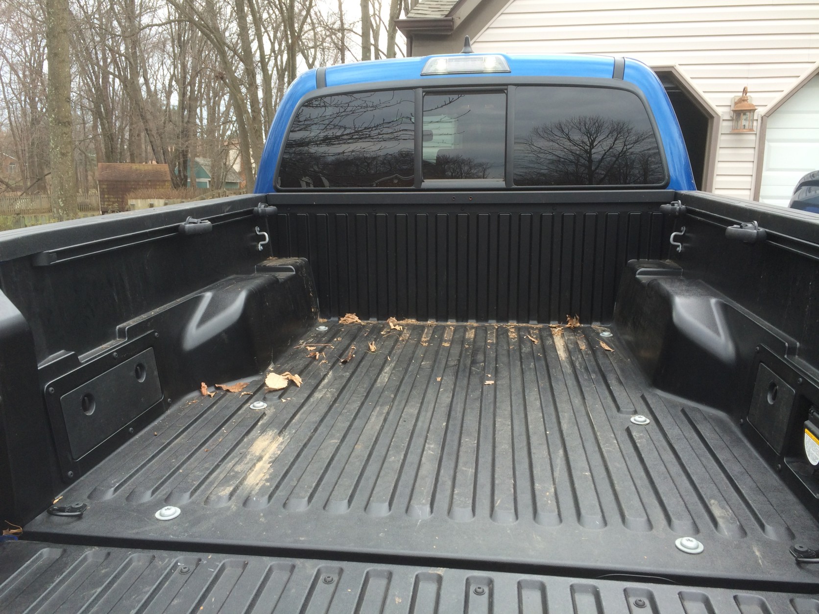 The bed has a neat cargo system with movable hooks, which helps when loading cargo and covering items you don’t want to blow away. (WTOP/Mike Parris)