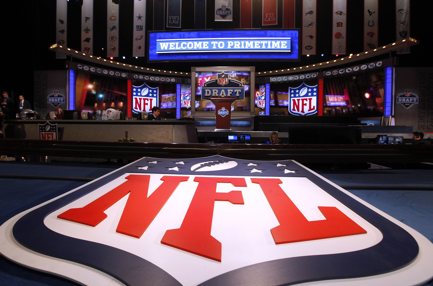 A large NFL logo decorates the stage before the first round of the NFL football draft at Radio City Music Hall, Thursday, April 25, 2013, in New York. (AP Photo/Jason DeCrow)