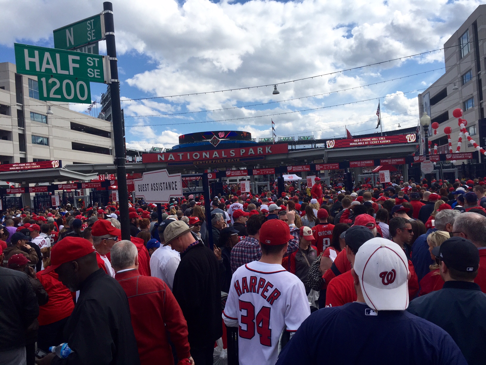 Fans make their way into Nationals Park for Opening Day 2016. The neighborhood around the ballpark is one of the city's hottest areas, (WTOP/Megan Cloherty)