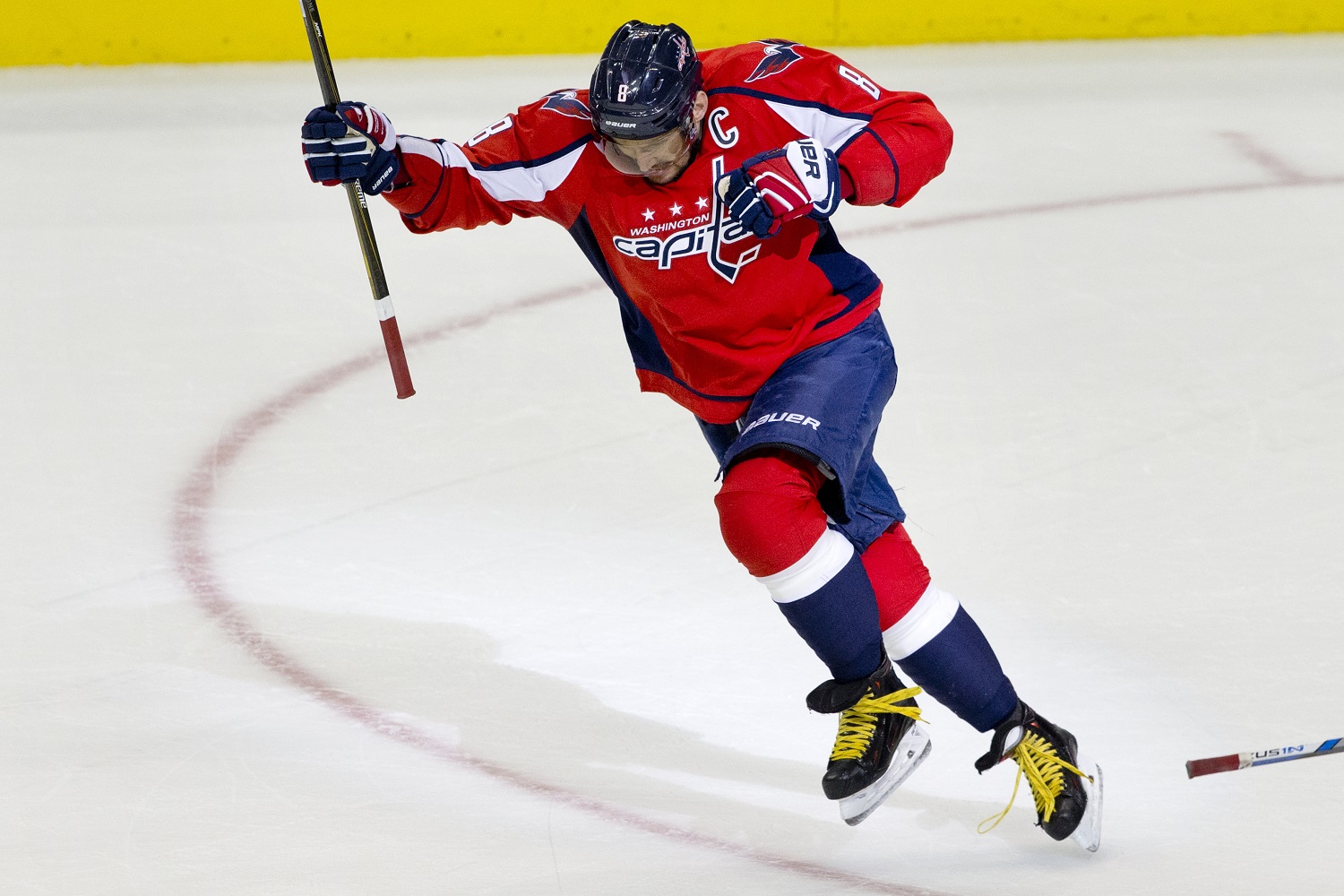 The Washington Capitals left wing Alex Ovechkin, (8), of Russia, leaps in the air in celebration after scoring his 500th career NHL goal during the second period of a hockey game against the Ottawa Senators in Washington, D.C., Sunday, Jan. 10, 2016. (AP Photo/Jacquelyn Martin)
