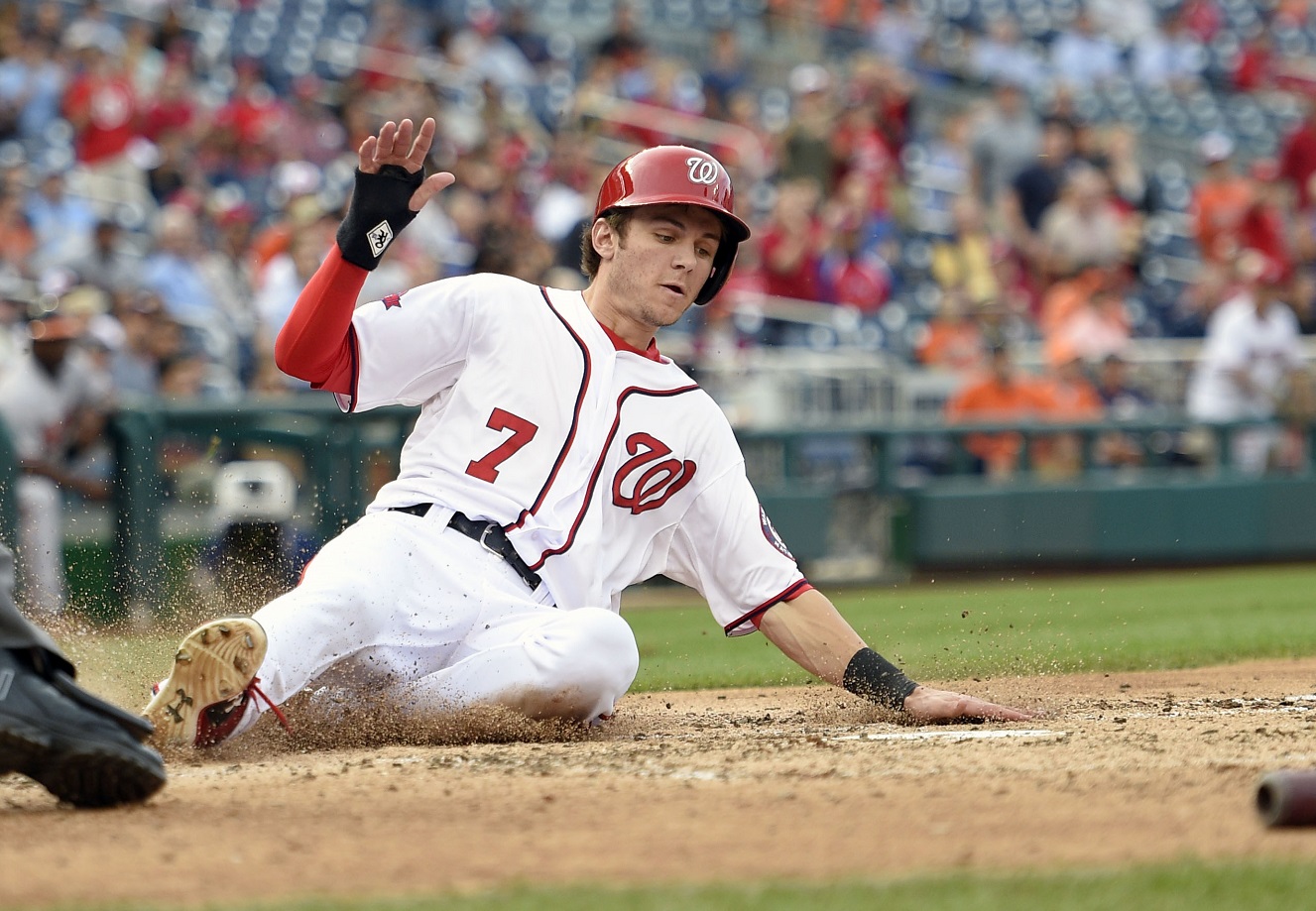 Washington Nationals' Trea Turner slides home to score on a single by Yunel Escobar during the fifth inning of an interleague baseball game against the Baltimore Orioles, Thursday, Sept. 24, 2015, in Washington. The Orioles won 5-4. (AP Photo/Nick Wass)