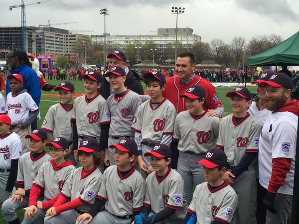 Little League players pose for a photo with Washington Nationals Ryan Zimmerman. Zimmerman helped fund a multipurpose facility in Southwest D.C. (WTOP/John Domen via Twitter) 