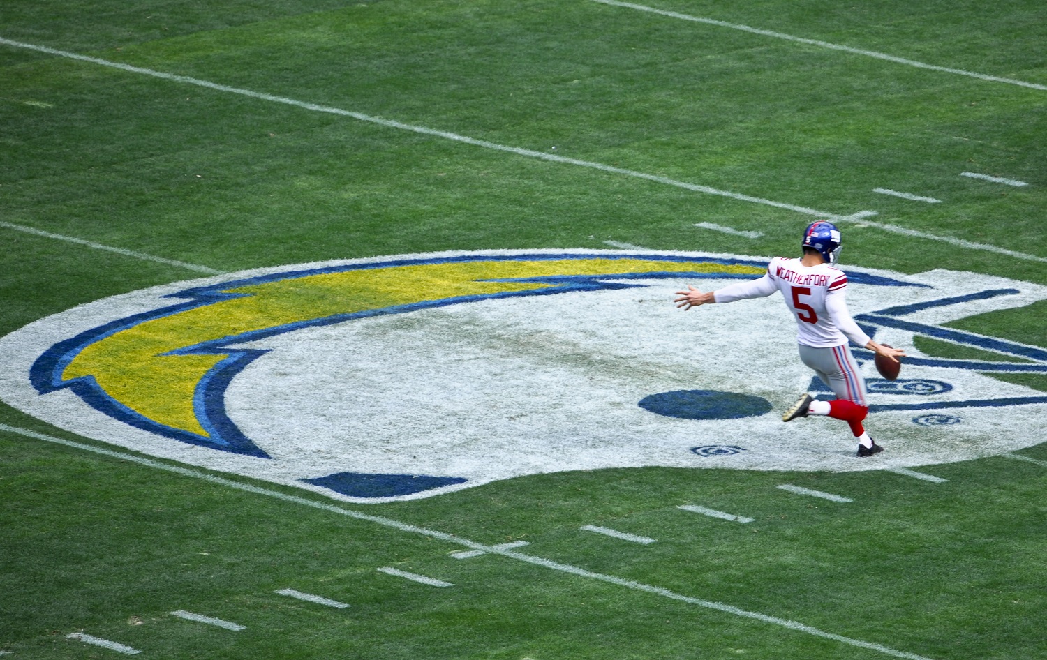 New York Giants punter Steve Weatherford warms up on the San Diego Chargers logo during pre-game activities before the NFL football game between the Chargers and  Giants  Sunday, Dec. 8, 2013, in San Diego. (AP Photo/Denis Poroy)