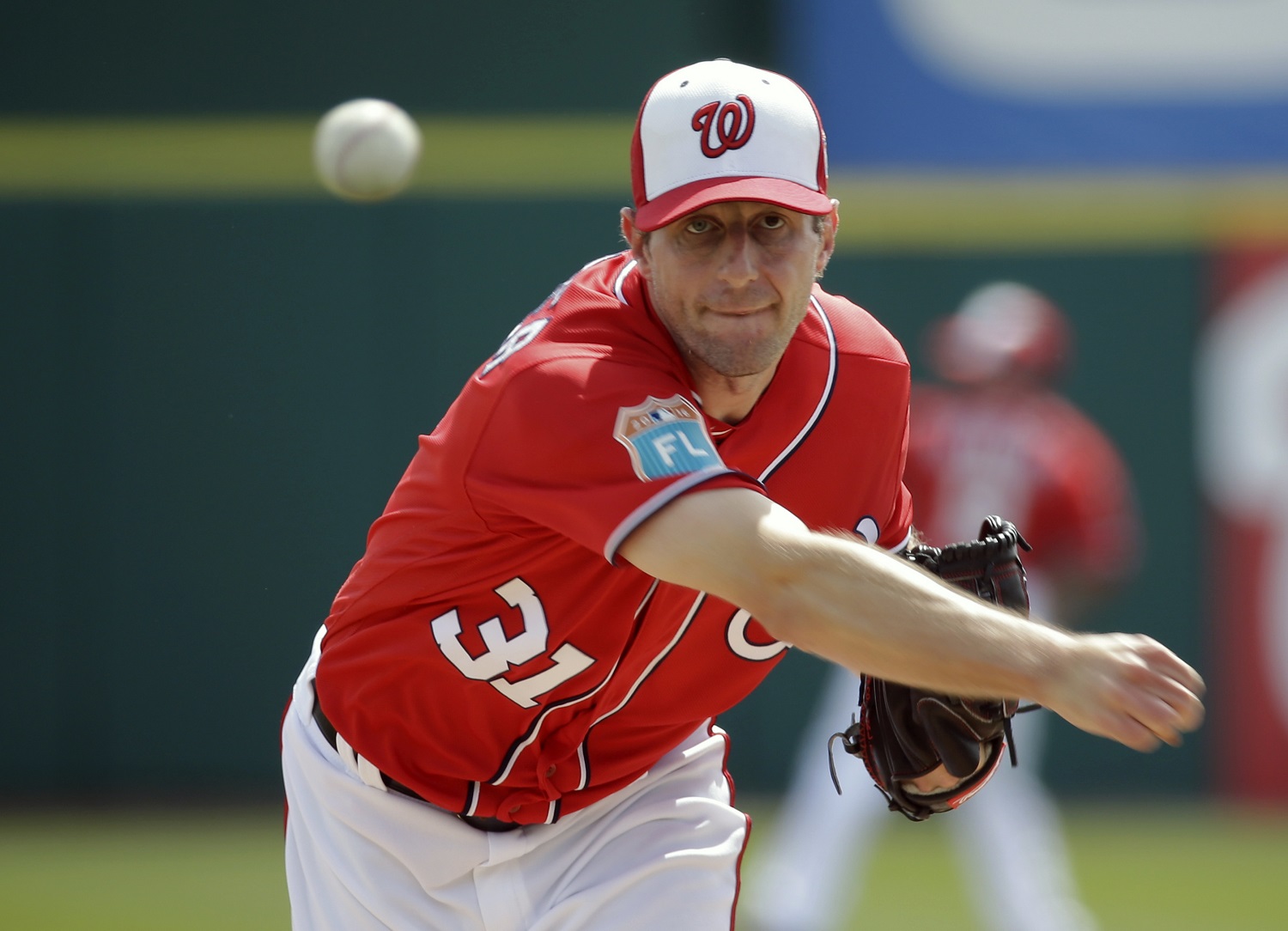 Washington Nationals starting pitcher Max Scherzer throws before a spring training baseball game against the New York Mets, Thursday, March 3, 2016, in Viera, Fla. (AP Photo/John Raoux)