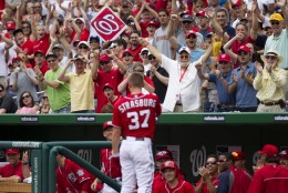 Washington Nationals' Stephen Strasburg (37) waves to the crowd after hitting his first career home run during the fourth inning of an interleague baseball game against the Baltimore Orioles in Washington, Sunday, May 20, 2012. (AP Photo/Manuel Balce Ceneta)