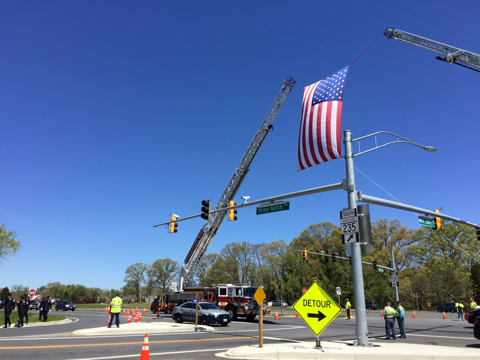 During the funeral mass, U.S. Rep. Steny Hoyer, D-Md., and Maryland Gov.  Larry Hogan each presented Ulmschneider's family with flags flown over the U.S. and state capitols. The flag presented by Prince George's County Fire Department Chief Marc Bashoor was flying over the fire department's headquarters the day Ulmschneider was fatally shot. (WTOP/Kristi King)