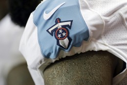 A Tennessee Titans logo is shown on a player during the second half of an NFL football preseason game against the Atlanta Falcons, Friday, Aug. 14, 2015, in Atlanta. (AP Photo/David Goldman)
