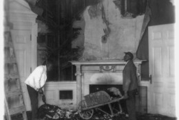 Workers collect fire-damaged debris from the Oval Office, December 26, 1929. (PHOTO: Library of Congress)