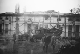 President Herbert Hoover looks at debris from the White House fire heaped on the grounds of the executive offices, January 15, 1930.