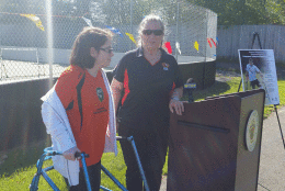 Mary Cassell (left) a soccer player who uses a walker and Pam Yerg, Montgomery Co. Director of Special Olympics. Yerg says Cassell is the reason she pushed to get an adaptive sports court. (WTOP/Kathy Stewart)