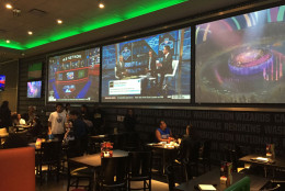 Here's a look at one of the dining areas that features massive TVs. (WTOP/Michelle Basch)