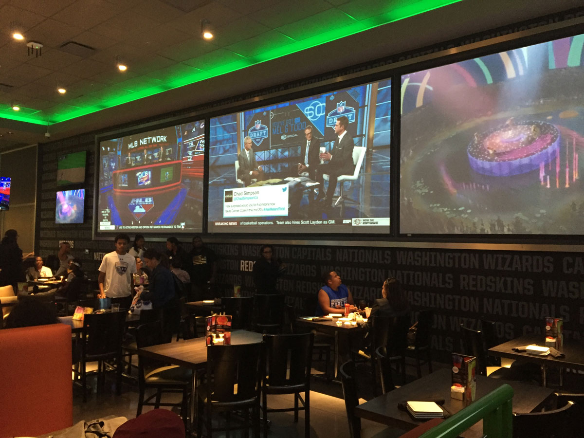 Here's a look at one of the dining areas that features massive TVs. (WTOP/Michelle Basch)