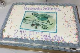 The graduation ceremony held in D.C. Superior Court's Jurors’ Lounge concluded with a buffet and congratulatory cake. (WTOP/Kristi King)