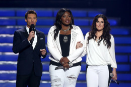 Host Ryan Seacrest, left, and finalists Candice Glover, center, and Kree Harrison speak on stage at the "American Idol" finale at the Nokia Theatre at L.A. Live on Thursday, May 16, 2013, in Los Angeles. (Photo by Matt Sayles/Invision/AP)