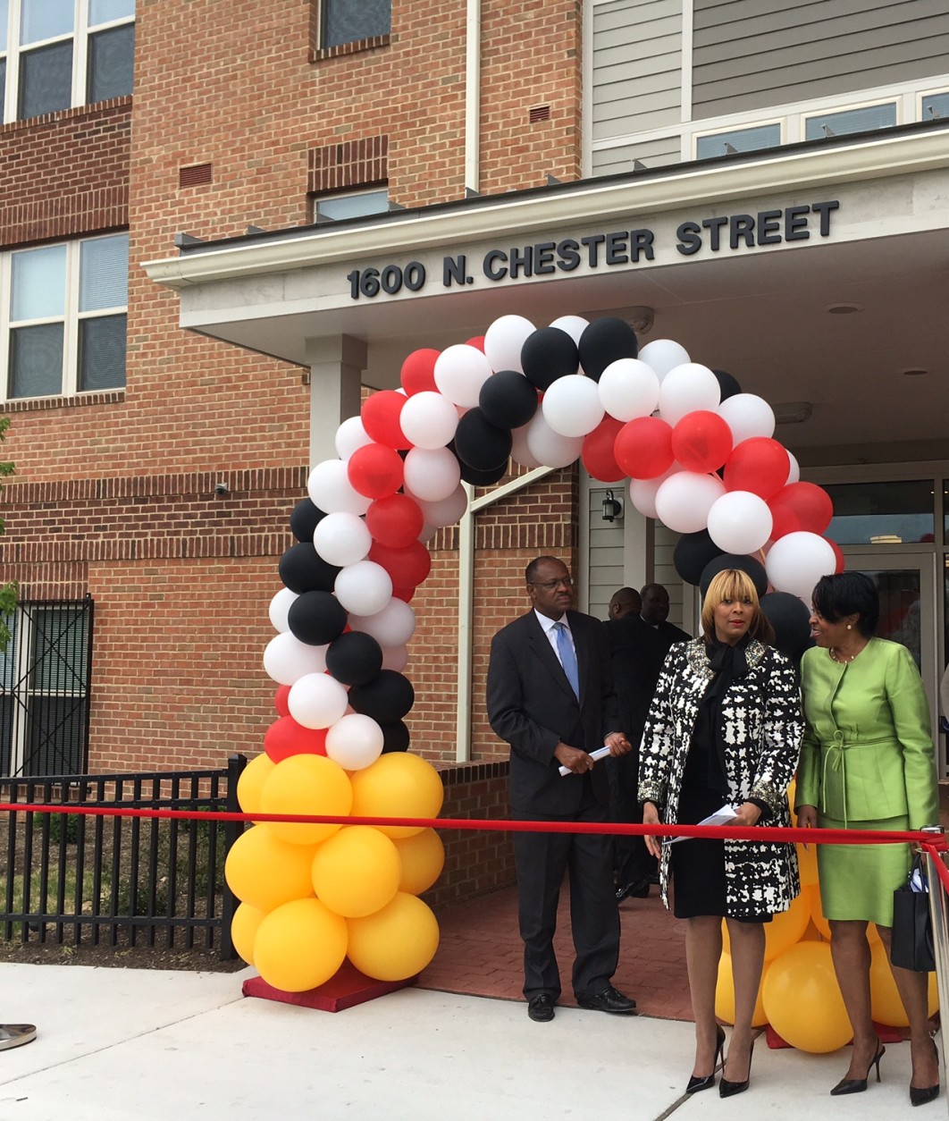 One year after the Baltimore riots, the entrance to the Mary Harvin Transformation Center was festooned with an archway of balloons, and Maryland Gov. Larry Hogan was among the dignitaries who attended the ribbon-cutting ceremony. (WTOP/Kate Ryan)