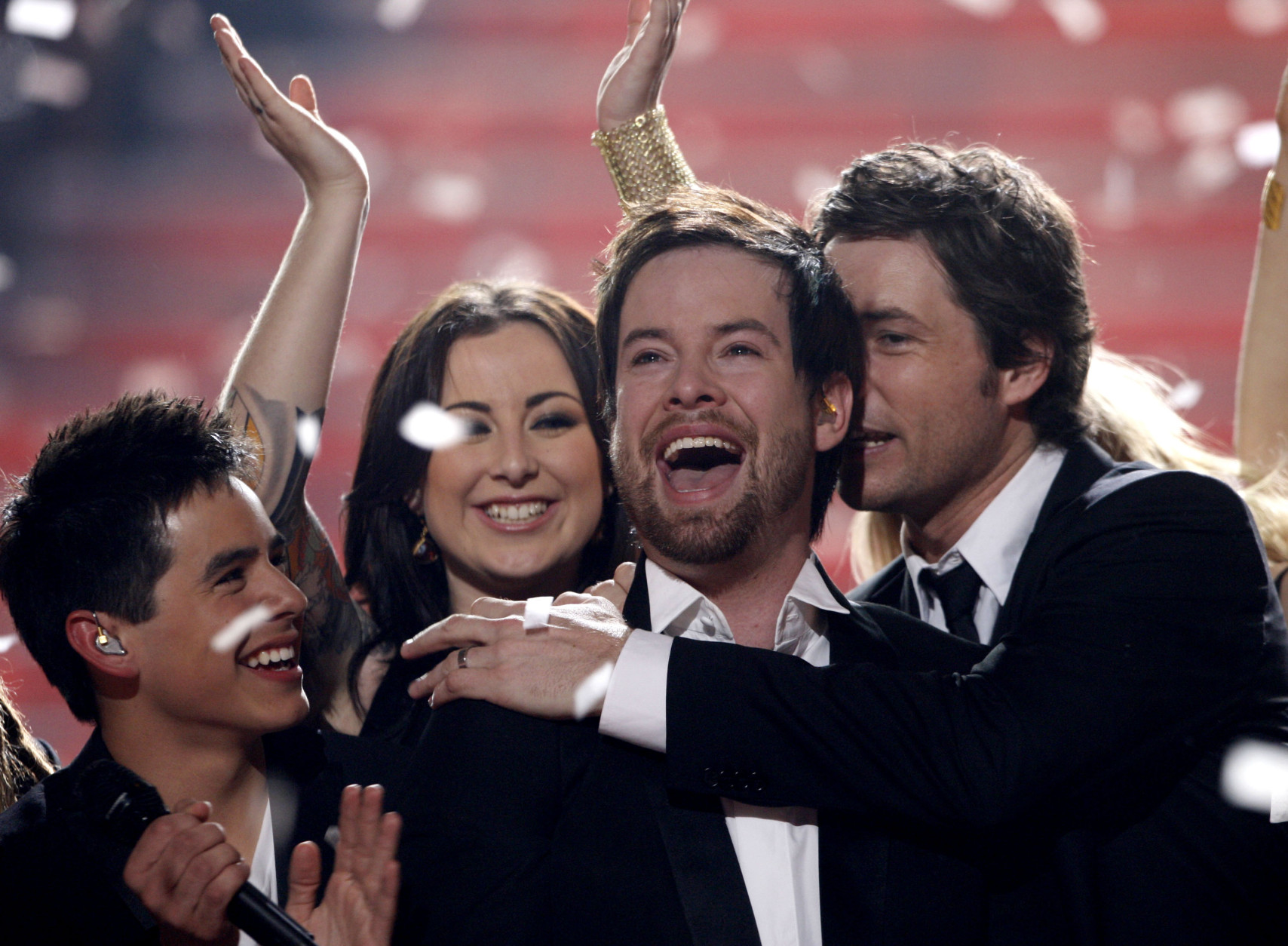 David Cook, center, is congratulated after being named the new American Idol during the season finale of American Idol on Wednesday May 21, 2008, in Los Angeles. (Mark Mainz/AP Images for Fox)
