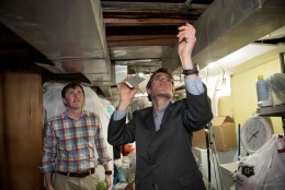 Marc Edwards examines plumbing in Flint, Michigan. (Photo courtesy Virginia Tech)
