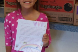 9-year-old Elizabeth Barry, a Girl Scout, dropped off cases of cookies to two Montgomery County police stations on Sunday, along with thank you letters to officers. (Courtesy Montgomery County Police Department)