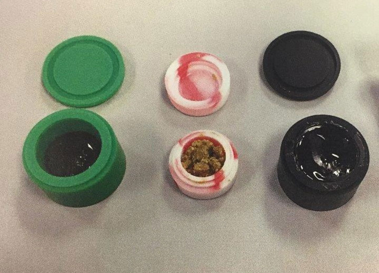 Two forms of marijuana derivatives in containers. (Courtesy Fairfax County Police Department)