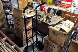 Boxes of used albums have been moved into display racks, with some still be relocated. (WTOP/Neal Augenstein)