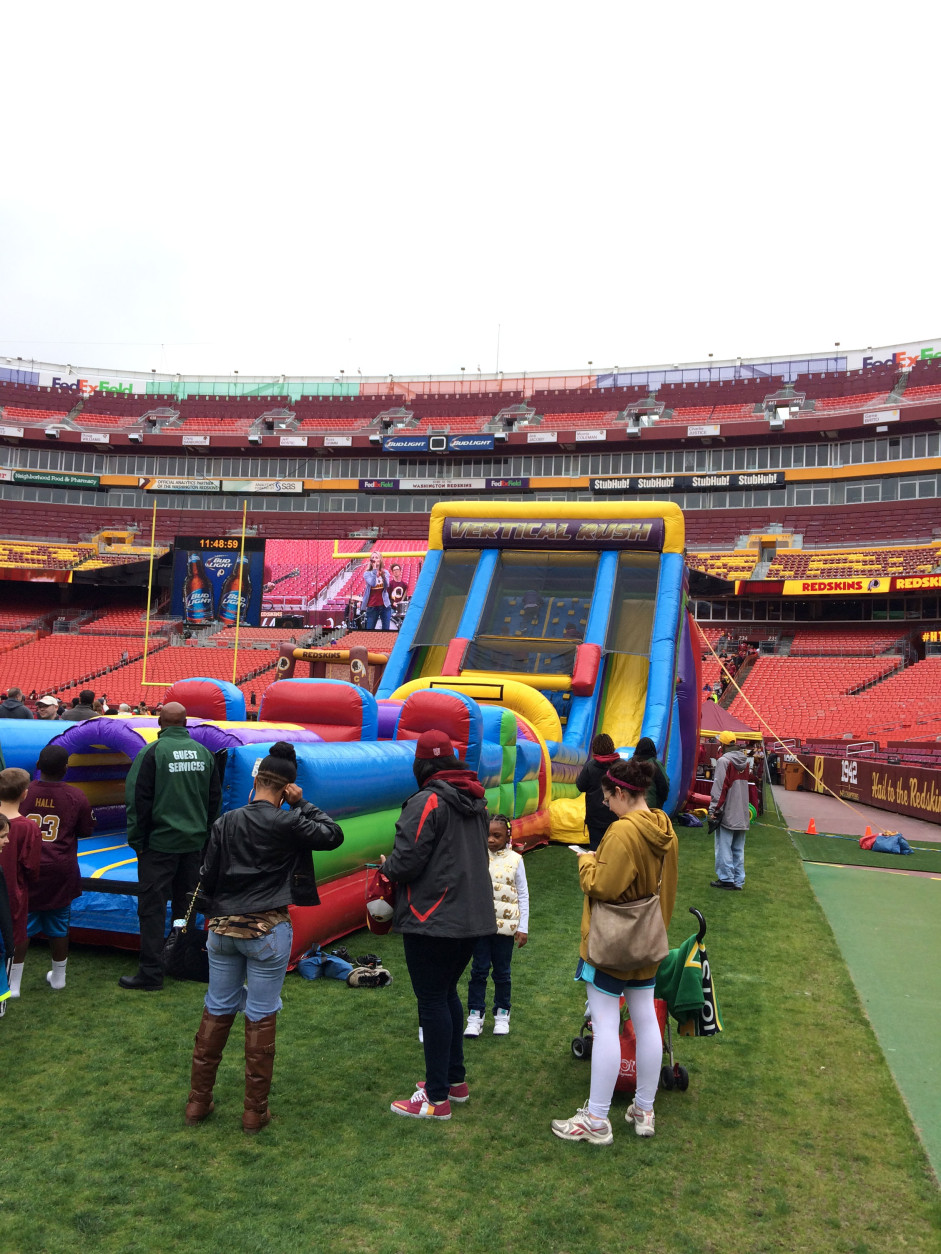 Kids enjoy the inflatables at FedExField on Saturday, April 30, 2016. (WTOP/Dick Uliano)
