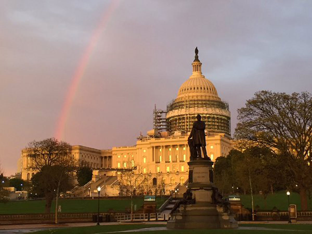 A rainbow is spotted over the U.S. Capitol. (Courtesy @NeisaCondemaita)