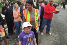 When asked if he wanted to help the mayor fill a pothole, the neighborhood kid told her he didn't know how. (WTOP/Megan Cloherty)