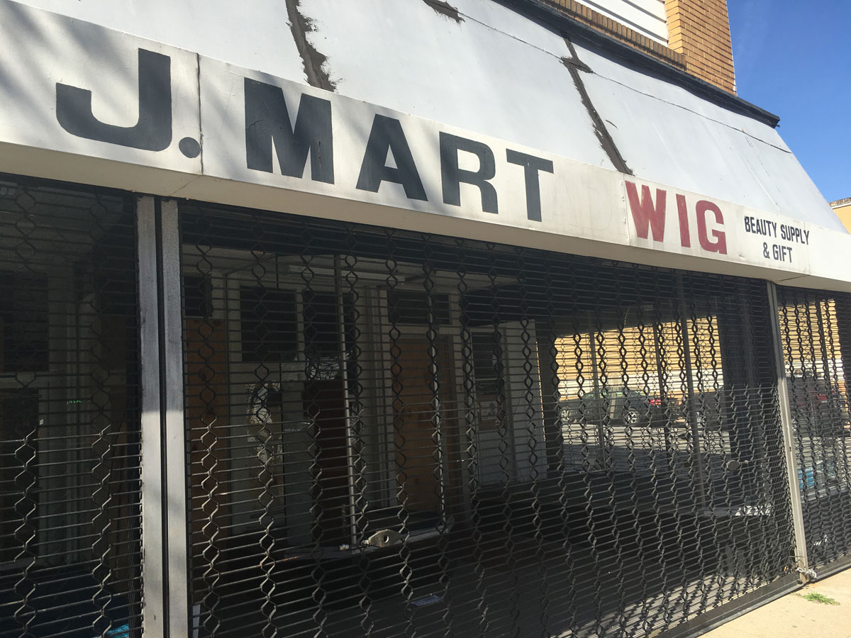J-Mart Wig, a family-owned store in west Baltimore, was unable to reopen after the riots. (WTOP/Mike Murillo)
