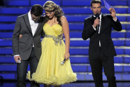 Finalists Scotty McCreery, left, and Lauren Alaina are seen onstage before host Ryan Seacrest announced the winner at the "American Idol" finale on Wednesday, May 25, 2011, in Los Angeles. (AP Photo/Chris Pizzello)