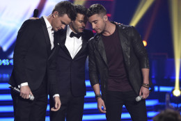Clark Beckham, from left, host Ryan Seacrest and Nick Fradiani await results at the American Idol XIV finale at the Dolby Theatre on Wednesday, May 13, 2015, in Los Angeles. (Photo by Chris Pizzello/Invision/AP)