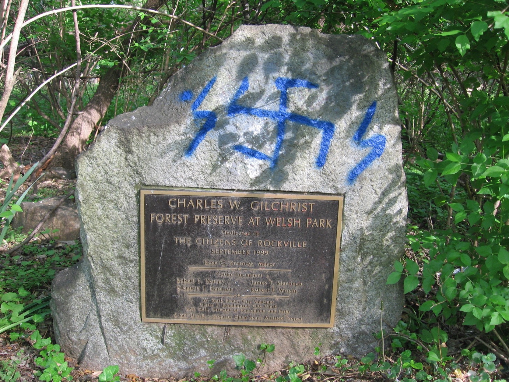 At Welsh Park on Mannakee Street, this monument and plaque commemorates “Charles W. Gilchrist – Forest Preserve at Welsh Park – Dedicated to the Citizens of Rockville.” (Courtesy Montgomery County Police)