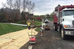 Work zones aren’t restricted to highways, though. On Tuesday morning, a crew worked to repair a culvert on a small street just off Hunter Mill Road.

This time the symphony was different; there were beeping trucks and loud engines as a handful of cars squeeze by. (WTOP/Max Smith)